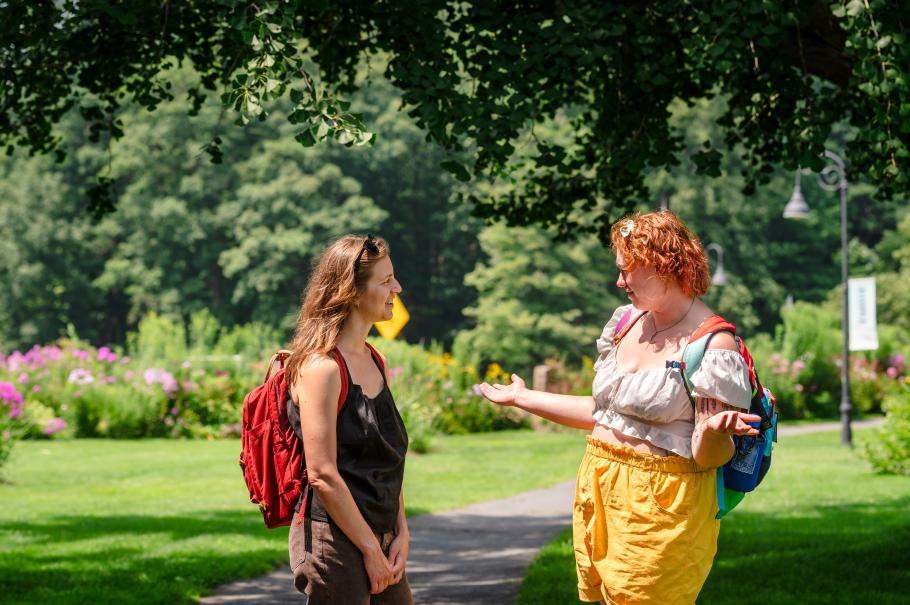 Students talk on campus between classes
