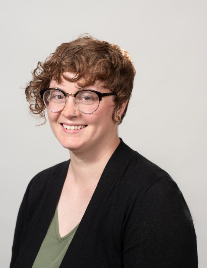 Photo of Taylor Haaf wearing a green top with a black blazer