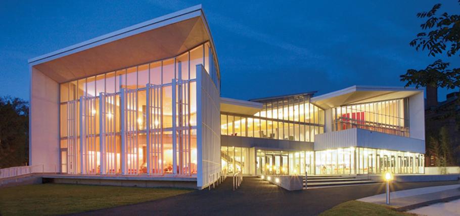 Julia McWilliams Child '34 Campus Center at Smith College lit at night.