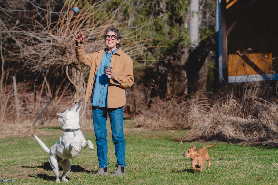 Asher outside with their dogs.