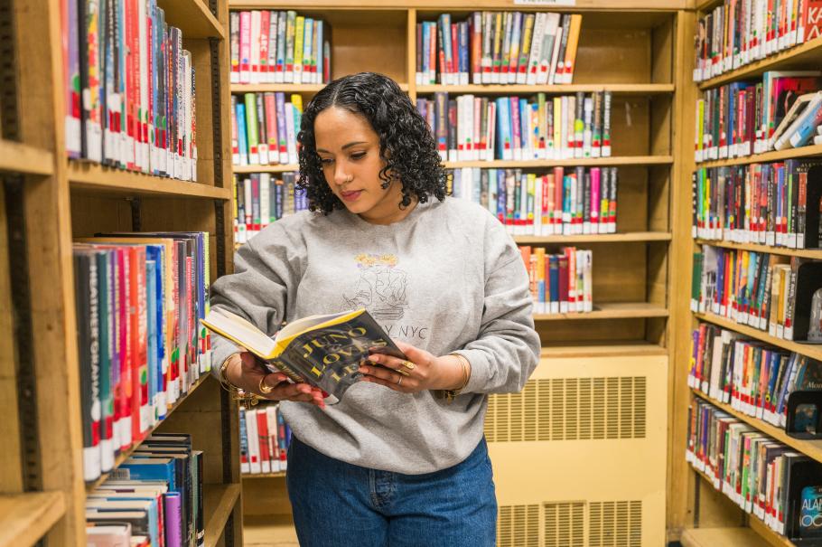 Emely identifies books to use in her work with her bibliotherapy clients.