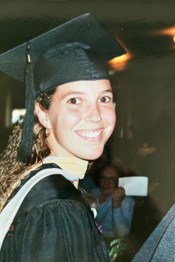 Lynn smiles at the camera during her commencement ceremony.