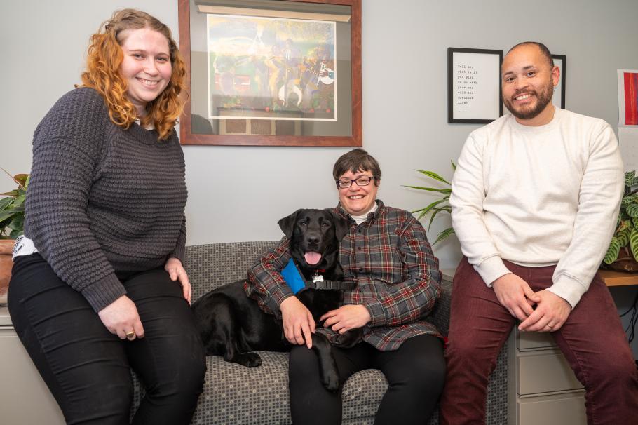 Beth Prullage, her dog, Rosie, and Sophie Parker-Goos, a second-year practicum student who Beth supervises and Malcolm Pradia, LICSW, SSW graduate of 2013 and adjunct faculty of SSW.