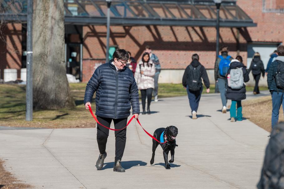 Pam Begay and her dog, Rosie, on campus.