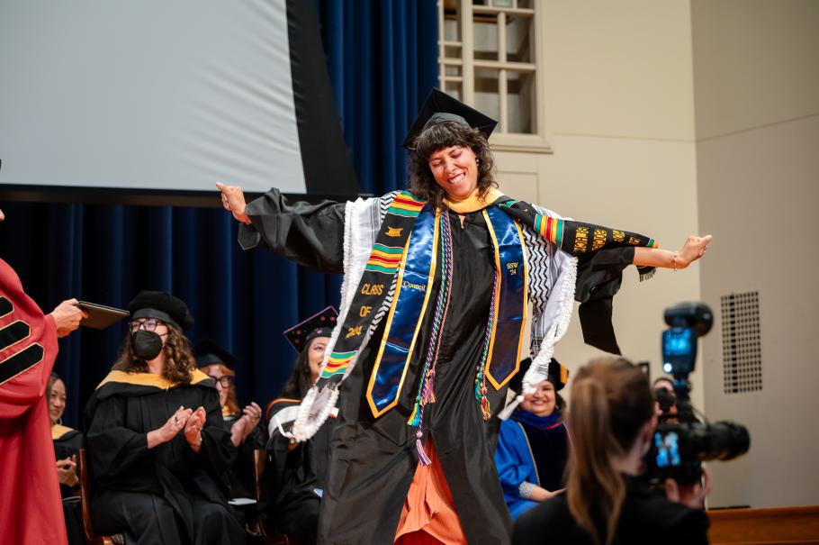 Aviva Davis dances across the stage during 2024 commencement