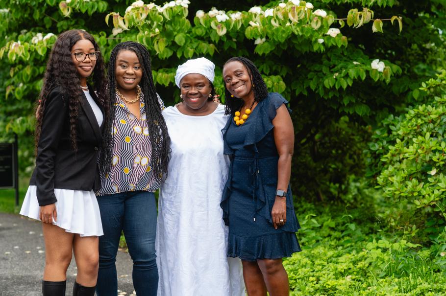 Adama Sallu poses with her family during the Alumni Awards Dinner in June 2024. 