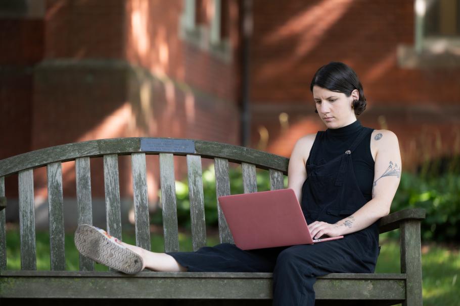 Lucy Haney sits on a bench on the Smith College campus.