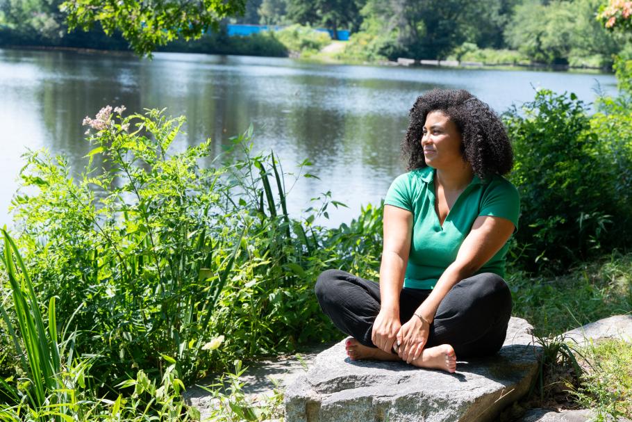 Alexis Minnis sits in front of Paradise Pond