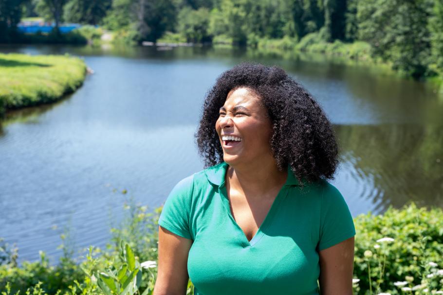 Alexis Minnis laughs in front of Paradise Pond