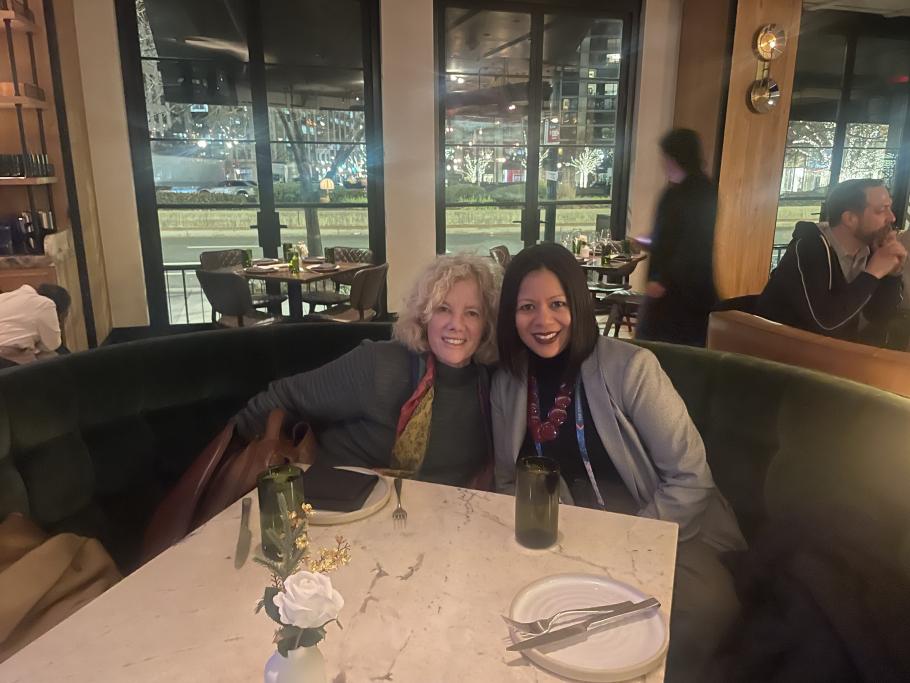 Marsha Kline Pruett and Cheryl Aguilar sitting in booth at restaurant during 2026 SSWR conference