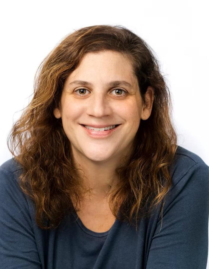 Danna Bodenheimer wearing blue shirt. White background