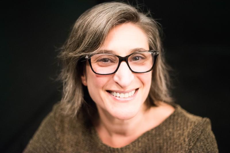 Instructor Alexandra Rafaeli smiles with glasses