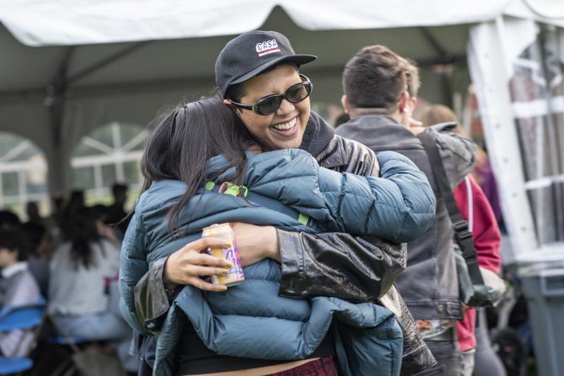 Two students hug during the 2023 Opening Ceremony at Smith College.