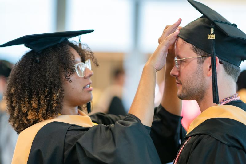 Pre-commencement cap straightening.