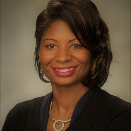 Portrait of Ronjonette O'Bannon wearing a black top and a necklace. 
