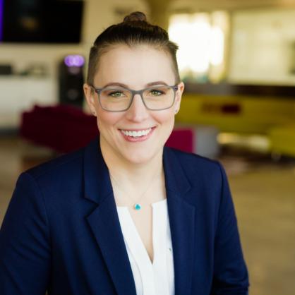 Amanda Baranski headshot with office behind