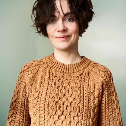 Astrid Watkins wearing tan sweater