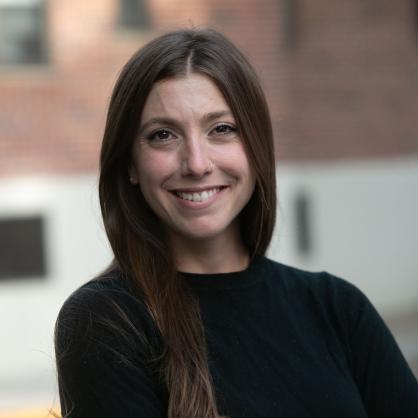 Judy Florio headshot outside with building behind