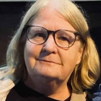 Patti McNamamy portrait wearing glasses