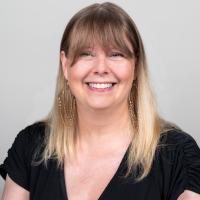 Christina Marie Tobey wearing black shirt smiling