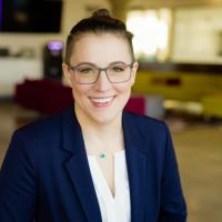 Amanda Baranski headshot with office behind