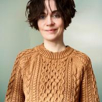 Astrid Watkins wearing tan sweater