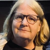 Patti McNamamy portrait wearing glasses