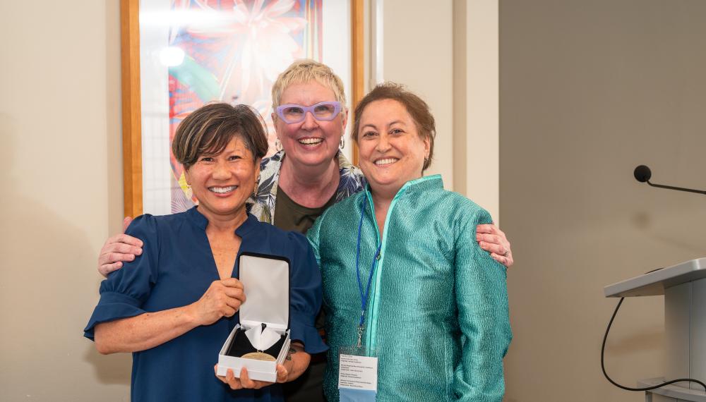 Yvette Colon poses with Dean Marianne Yoshioka and Director of Development Dawn Faucher during the summer 2024 Alumni Awards Dinner.