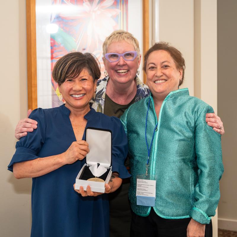 Yvette Colon poses with Dean Marianne Yoshioka and Director of Development Dawn Faucher during the summer 2024 Alumni Awards Dinner.