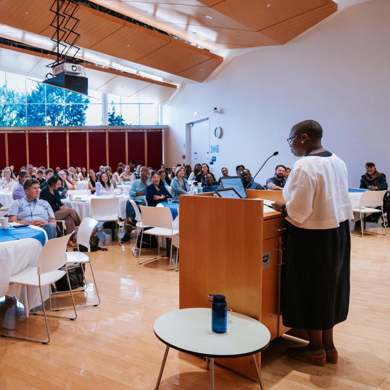 A room full of conference attendees listen carefully to the 2025 Keynote Speaker at the Deepening Clinical Practice Conference.