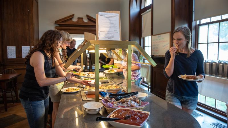 Students serve themselves food from a buffet line in King-Scales dining room.