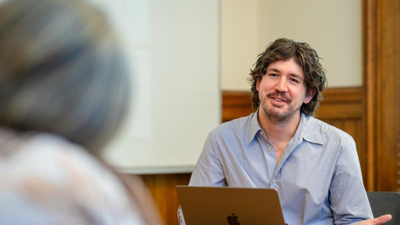 Doctoral students engage in conversation during their seminar class. 